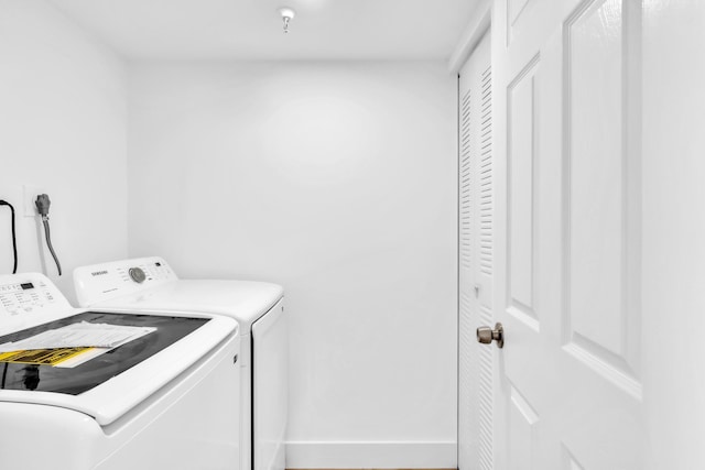 7076 Huntington Ln Unit 206, Delray Beach, FL 33446 - laundry room featuring washing machine and clothes dryer
