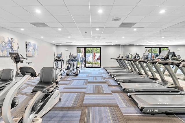 7076 Huntington Ln Unit 206, Delray Beach, FL 33446 - gym featuring healthy amount of natural light, carpet, recessed lighting, and a paneled ceiling