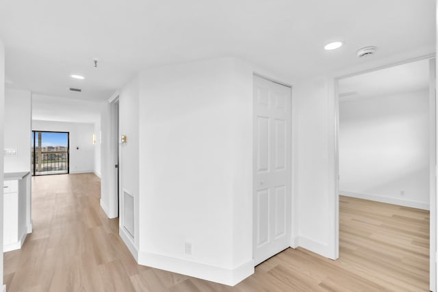 7076 Huntington Ln Unit 206, Delray Beach, FL 33446 - corridor featuring light wood-type flooring and recessed lighting
