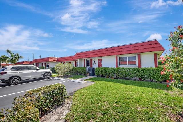 5800 Fernley Dr W Unit 51, Greenacres, FL 33415 - ranch-style house featuring uncovered parking, stucco siding, mansard roof, a front lawn, and a tiled roof