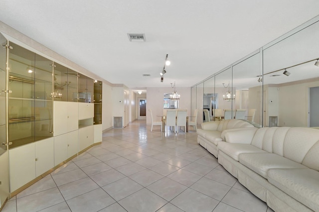 5800 Fernley Dr W Unit 51, Greenacres, FL 33415 - living room featuring a chandelier, light tile patterned floors, and baseboards