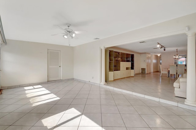 5800 Fernley Dr W Unit 51, Greenacres, FL 33415 - unfurnished living room with a ceiling fan, ornate columns, light tile patterned flooring, a chandelier, and track lighting