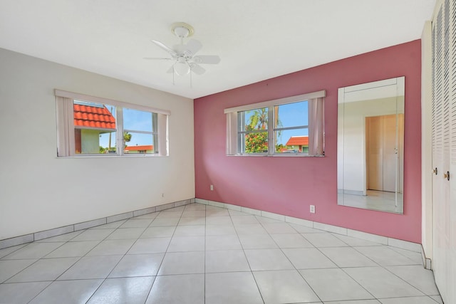 5800 Fernley Dr W Unit 51, Greenacres, FL 33415 - empty room featuring healthy amount of natural light, ceiling fan, and baseboards