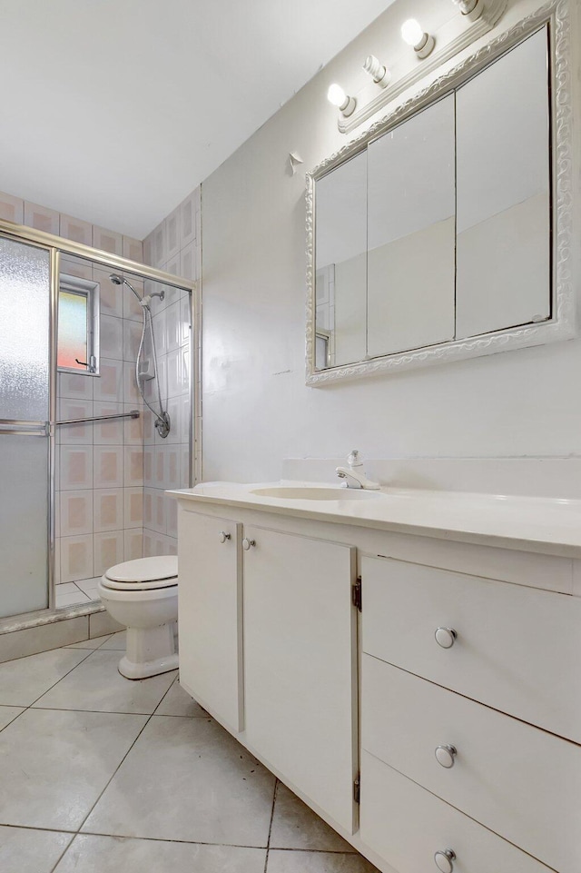 5800 Fernley Dr W Unit 51, Greenacres, FL 33415 - full bath with vanity, a shower stall, toilet, and tile patterned floors