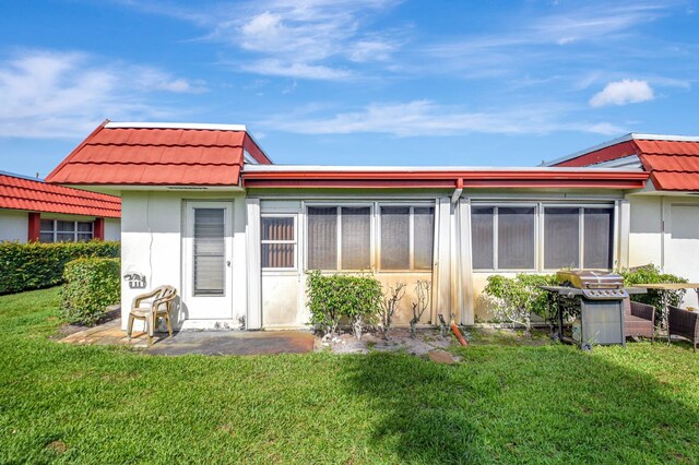 5800 Fernley Dr W Unit 51, Greenacres, FL 33415 - back of house featuring a tile roof, stucco siding, and a lawn