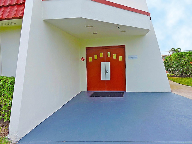 5800 Fernley Dr W Unit 51, Greenacres, FL 33415 - doorway to property featuring stucco siding