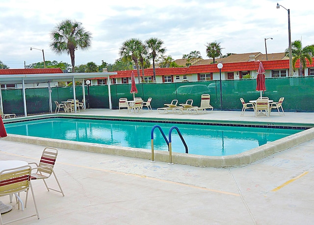 5800 Fernley Dr W Unit 51, Greenacres, FL 33415 - community pool featuring a patio