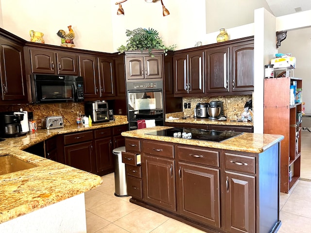 5775 Reynolds Rd, Lake Worth, FL 33449 - kitchen with black appliances, tasteful backsplash, light tile patterned floors, and dark brown cabinetry