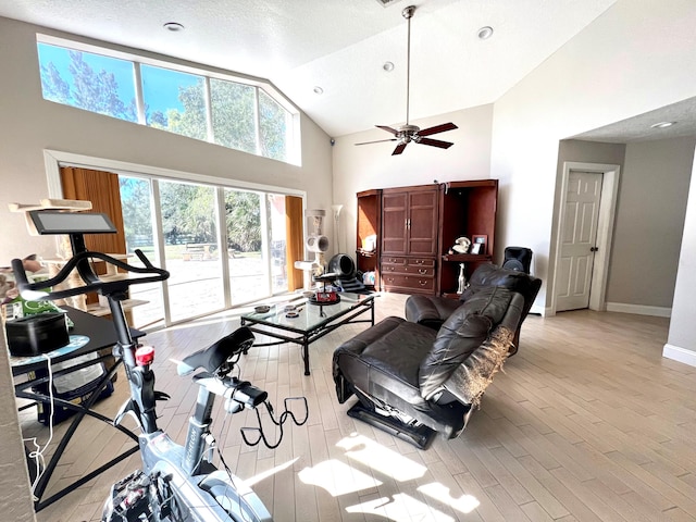 5775 Reynolds Rd, Lake Worth, FL 33449 - living room with high vaulted ceiling, light wood-type flooring, ceiling fan, baseboards, and recessed lighting