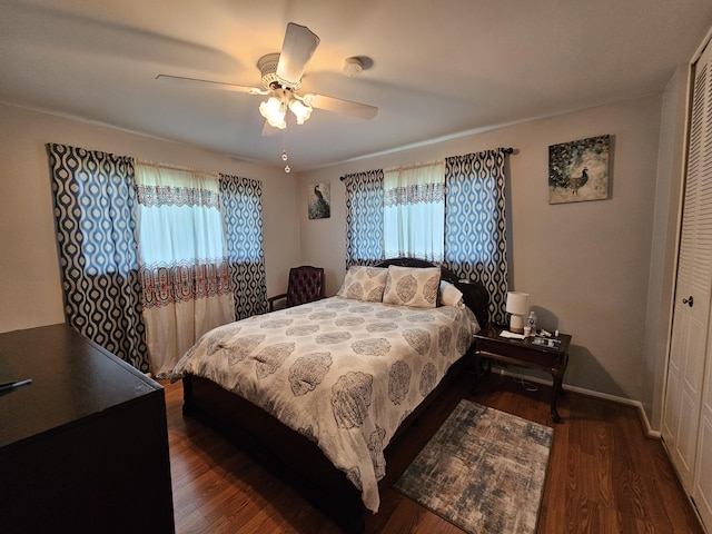 5730 Fernley Dr E Unit 4, West Palm Beach, FL 33415 - bedroom featuring dark wood-style flooring, multiple windows, a closet, and ceiling fan