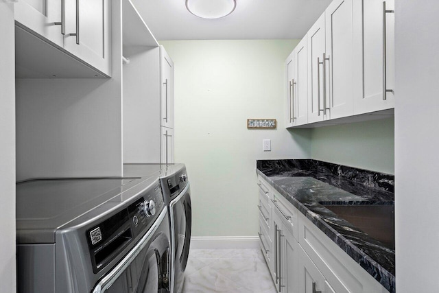 7578 Regency Lake Dr Unit 802, Boca Raton, FL 33433 - laundry room with light marble finish flooring, washer and clothes dryer, and cabinet space