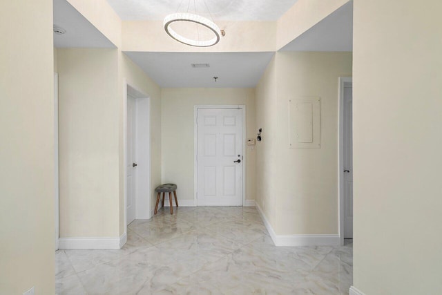 7578 Regency Lake Dr Unit 802, Boca Raton, FL 33433 - hall with marble finish flooring, electric panel, and a chandelier
