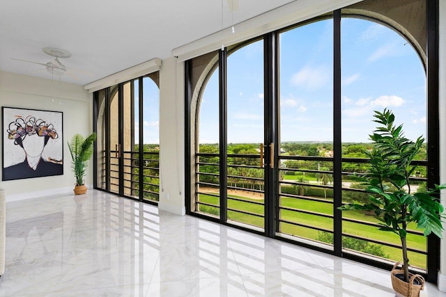 7578 Regency Lake Dr Unit 802, Boca Raton, FL 33433 - spare room with baseboards and light marble finish flooring