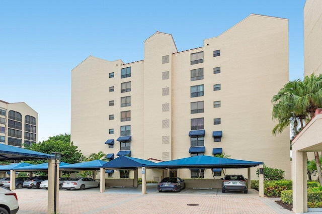 7578 Regency Lake Dr Unit 802, Boca Raton, FL 33433 - view of apartment building / complex with covered parking