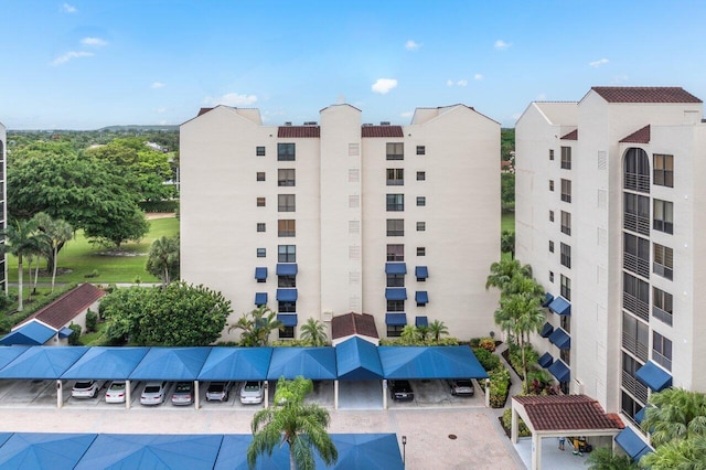 7578 Regency Lake Dr Unit 802, Boca Raton, FL 33433 - view of apartment building / complex with a parking lot