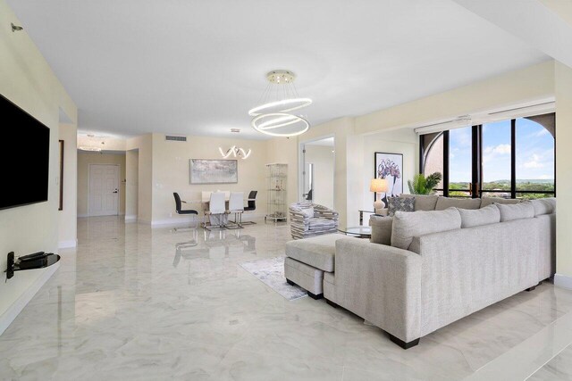 7578 Regency Lake Dr Unit 802, Boca Raton, FL 33433 - living room featuring a chandelier and light marble finish flooring
