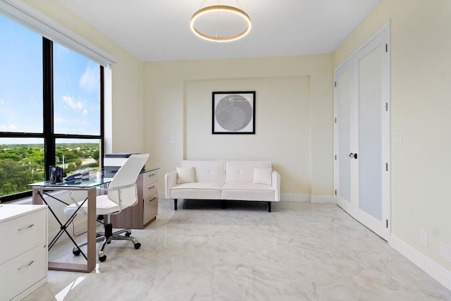 7578 Regency Lake Dr Unit 802, Boca Raton, FL 33433 - home office featuring light marble finish flooring and healthy amount of natural light
