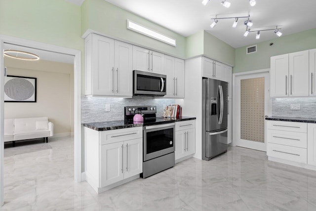 7578 Regency Lake Dr Unit 802, Boca Raton, FL 33433 - kitchen featuring appliances with stainless steel finishes, light marble finish flooring, backsplash, and white cabinetry