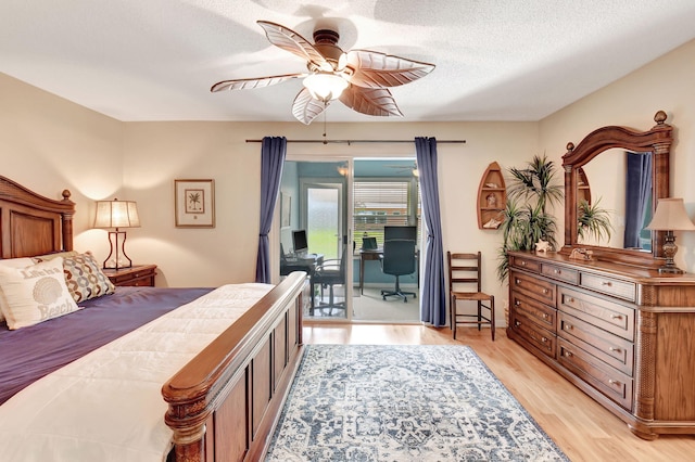 200 N High Point Blvd Unit C, Boynton Beach, FL 33435 - bedroom with access to exterior, light wood-type flooring, ceiling fan, and a textured ceiling