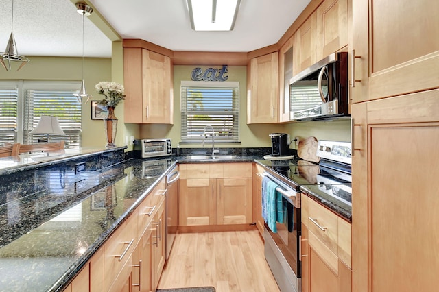 200 N High Point Blvd Unit C, Boynton Beach, FL 33435 - kitchen featuring stainless steel appliances, a sink, light brown cabinets, and light wood-type flooring