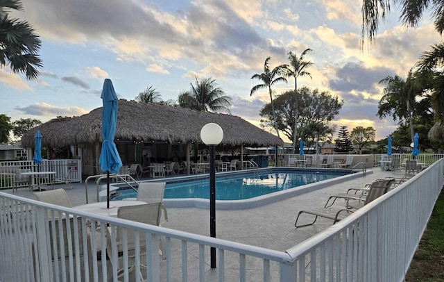 200 N High Point Blvd Unit C, Boynton Beach, FL 33435 - pool at dusk with a patio and a community pool
