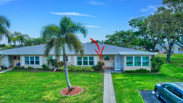200 N High Point Blvd Unit C, Boynton Beach, FL 33435 - ranch-style home featuring a front yard, stucco siding, and roof with shingles