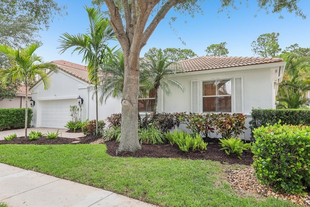 139 Sedona Way, Palm Beach Gardens, FL 33418 - mediterranean / spanish-style house with a tile roof, a garage, stucco siding, driveway, and a front yard