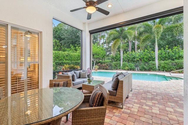 139 Sedona Way, Palm Beach Gardens, FL 33418 - sunroom / solarium featuring a swimming pool and view of wooded area