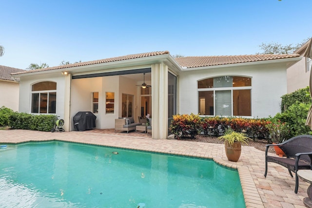 139 Sedona Way, Palm Beach Gardens, FL 33418 - rear view of property featuring a patio area, a tiled roof, an outdoor pool, and stucco siding