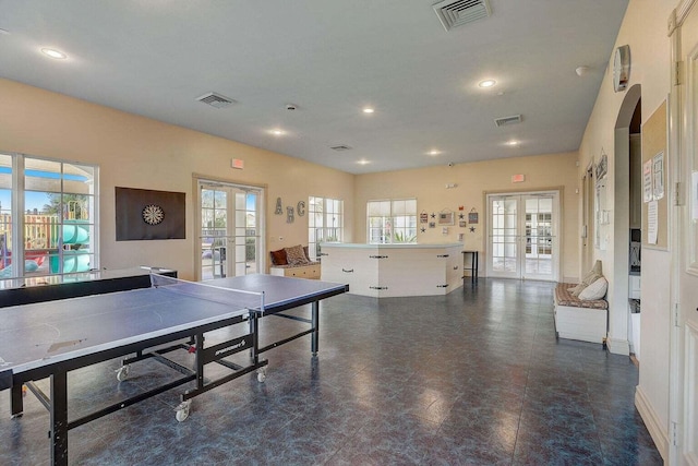 139 Sedona Way, Palm Beach Gardens, FL 33418 - recreation room featuring french doors, arched walkways, and recessed lighting