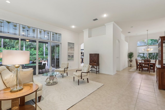 139 Sedona Way, Palm Beach Gardens, FL 33418 - living room with plenty of natural light, a chandelier, crown molding, recessed lighting, and arched walkways