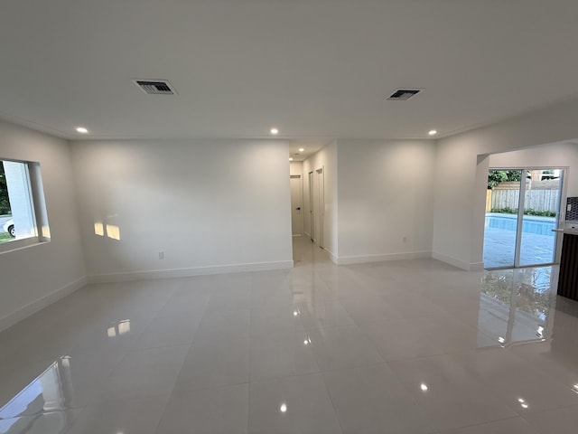 345 Pinehurst Rd, Palm Springs, FL 33461 - empty room with recessed lighting, light tile patterned floors, and baseboards