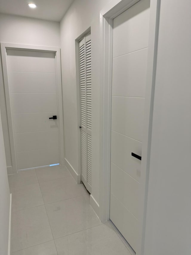 345 Pinehurst Rd, Palm Springs, FL 33461 - corridor featuring light tile patterned floors, recessed lighting, and baseboards