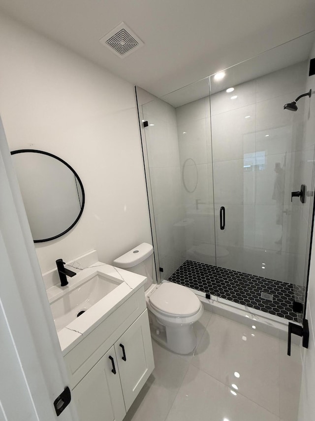 345 Pinehurst Rd, Palm Springs, FL 33461 - full bath featuring vanity, a stall shower, toilet, and tile patterned floors