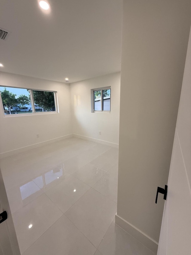 345 Pinehurst Rd, Palm Springs, FL 33461 - empty room featuring baseboards, light tile patterned floors, and recessed lighting