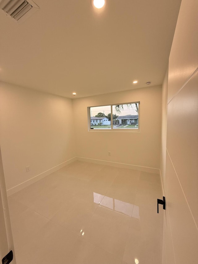 345 Pinehurst Rd, Palm Springs, FL 33461 - spare room featuring light tile patterned floors, recessed lighting, and baseboards