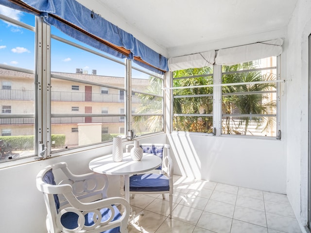 715 Lori Dr Unit 213, Palm Springs, FL 33461 - sunroom with healthy amount of natural light and tile patterned flooring