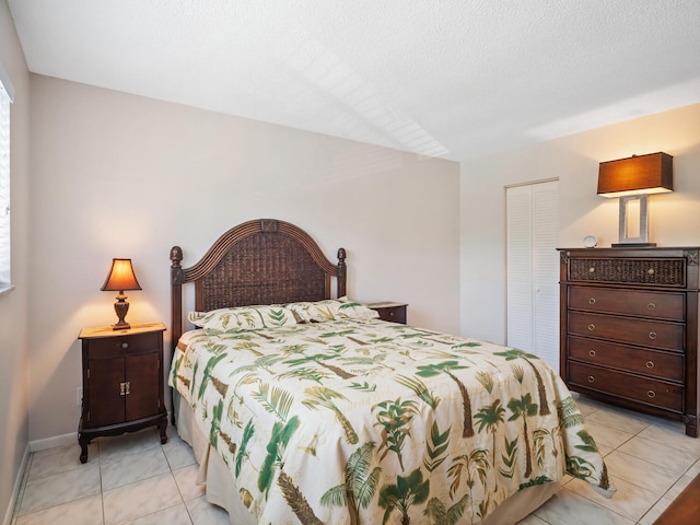 715 Lori Dr Unit 213, Palm Springs, FL 33461 - bedroom featuring a closet and light tile patterned floors
