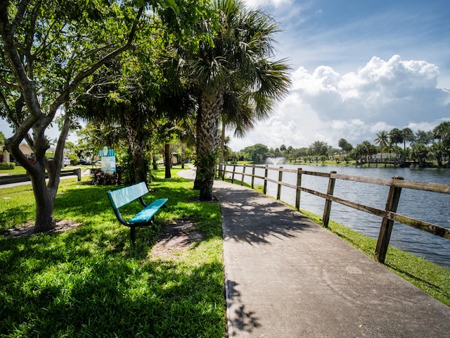 715 Lori Dr Unit 213, Palm Springs, FL 33461 - view of property's community with a lawn and a water view