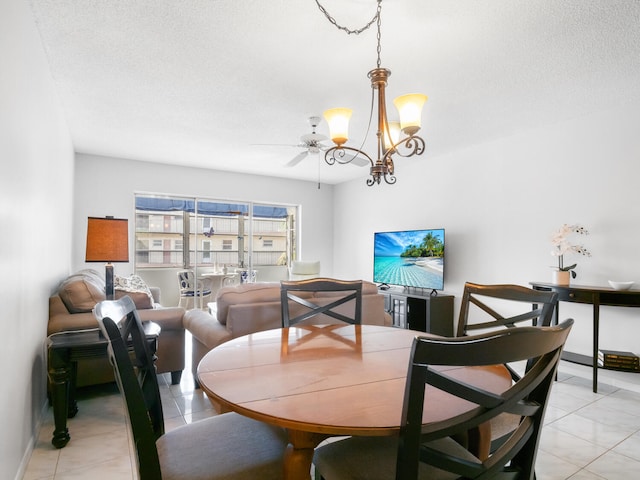 715 Lori Dr Unit 213, Palm Springs, FL 33461 - dining area featuring a chandelier, baseboards, and a textured ceiling