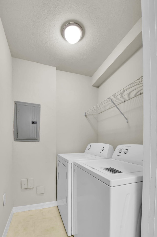 15185 Michelangelo Blvd Unit 204, Delray Beach, FL 33446 - washroom with electric panel, independent washer and dryer, a textured ceiling, and baseboards