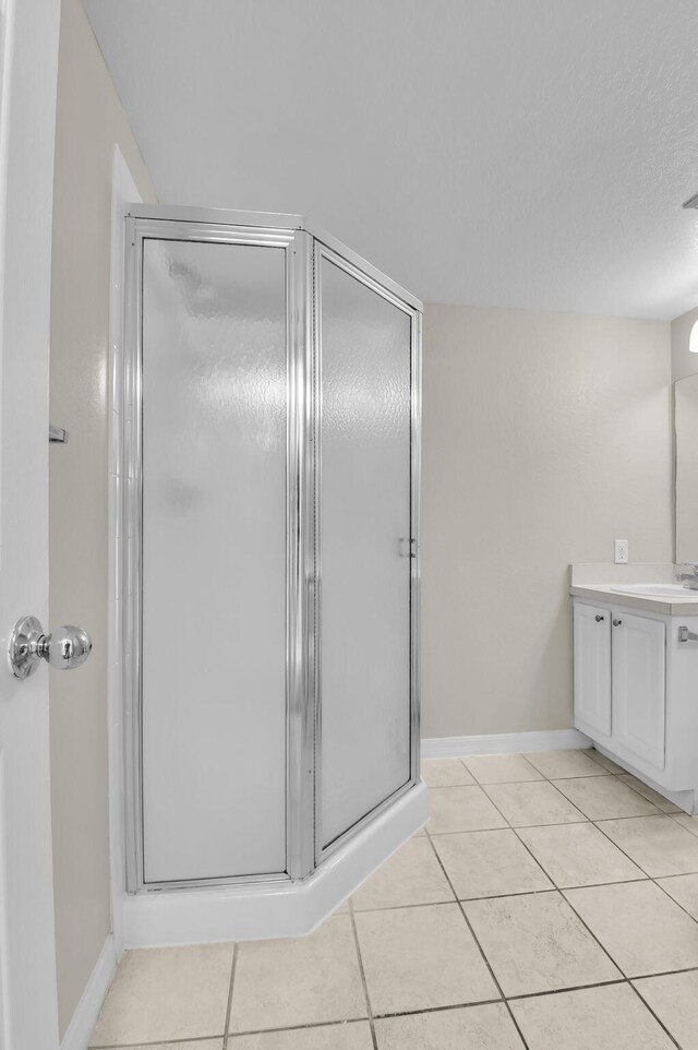 15185 Michelangelo Blvd Unit 204, Delray Beach, FL 33446 - full bath with vanity, a stall shower, and tile patterned flooring