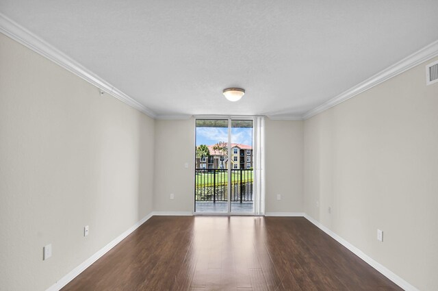 15185 Michelangelo Blvd Unit 204, Delray Beach, FL 33446 - empty room featuring dark wood finished floors, ornamental molding, and baseboards