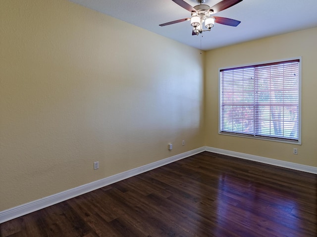 473 SW Dagget Ave, Port Saint Lucie, FL 34953 - spare room featuring dark wood finished floors, baseboards, and a ceiling fan