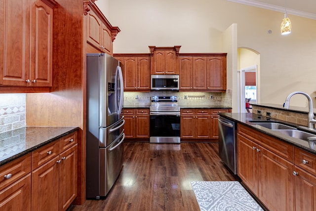 473 SW Dagget Ave, Port Saint Lucie, FL 34953 - kitchen featuring stainless steel appliances, a sink, decorative backsplash, and ornamental molding