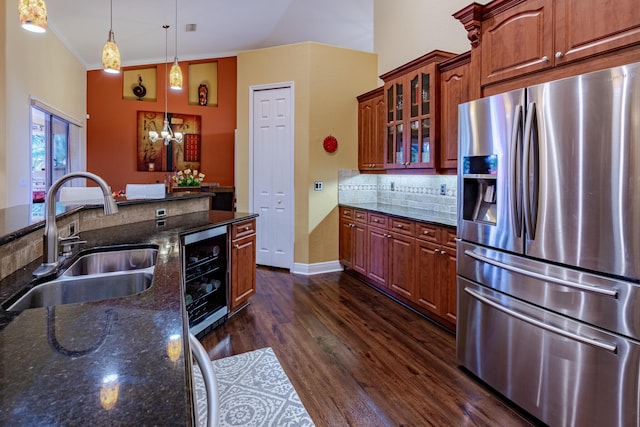 473 SW Dagget Ave, Port Saint Lucie, FL 34953 - kitchen featuring stainless steel fridge, a sink, wine cooler, decorative backsplash, and dark wood-style floors