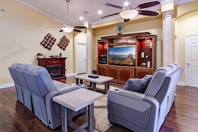 473 SW Dagget Ave, Port Saint Lucie, FL 34953 - living room with a ceiling fan, crown molding, ornate columns, a glass covered fireplace, and recessed lighting