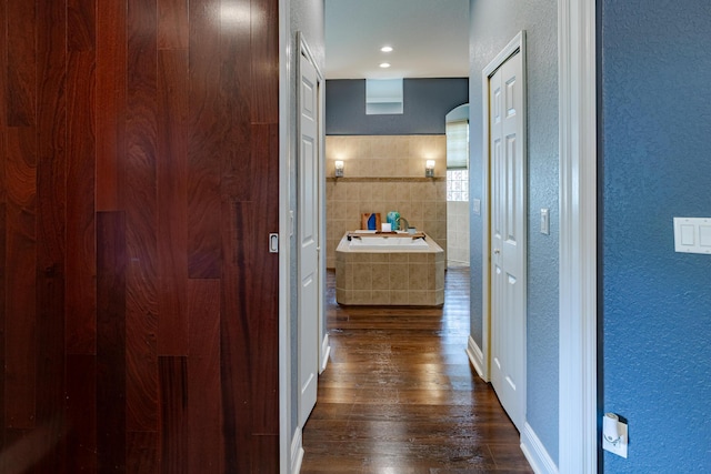 473 SW Dagget Ave, Port Saint Lucie, FL 34953 - hall with a textured wall and dark wood finished floors