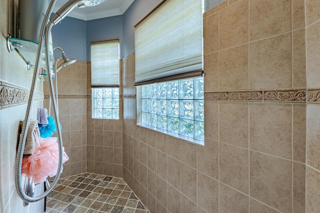 473 SW Dagget Ave, Port Saint Lucie, FL 34953 - bathroom featuring a tile shower and ornamental molding