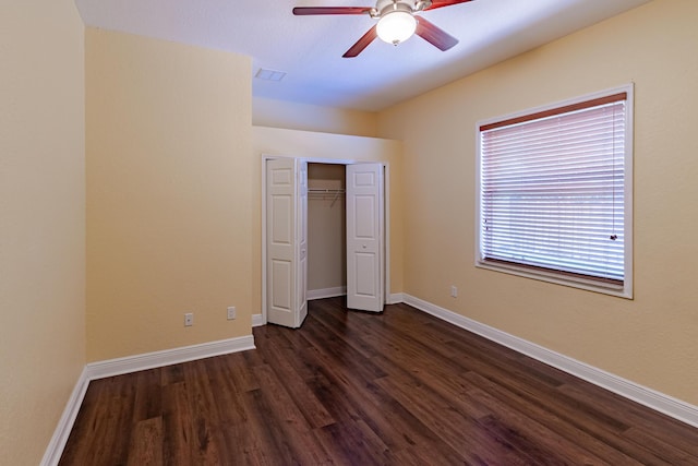 473 SW Dagget Ave, Port Saint Lucie, FL 34953 - unfurnished bedroom with dark wood-style floors, baseboards, and a closet